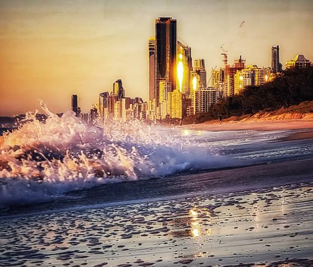 Sunrise Beach wave with city background view