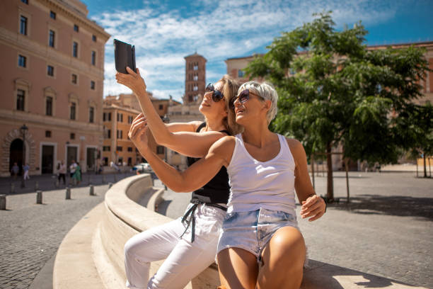 istock Two beautiful mature female friends sightseeing in Rome 2162759708