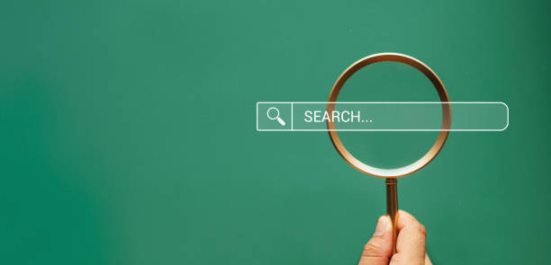 istock hand holding magnifying glass. Searching for information. Using Search Console with your website. Data Search Technology Search Engine Optimization. Online business search a job for work 2162759736