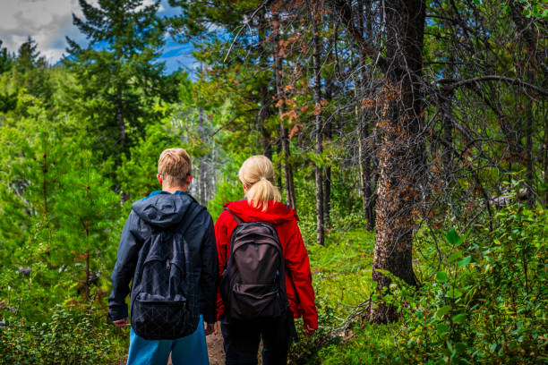 istock mother and son hiking in a forest in Alberta in Canada 2162762464