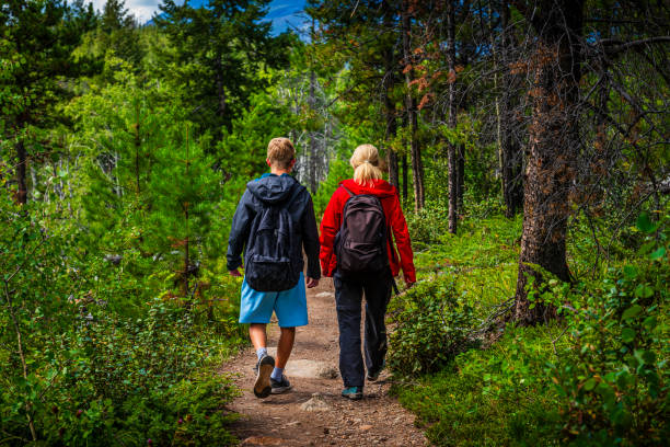 istock mother and son hiking in a forest in Alberta in Canada 2162762477