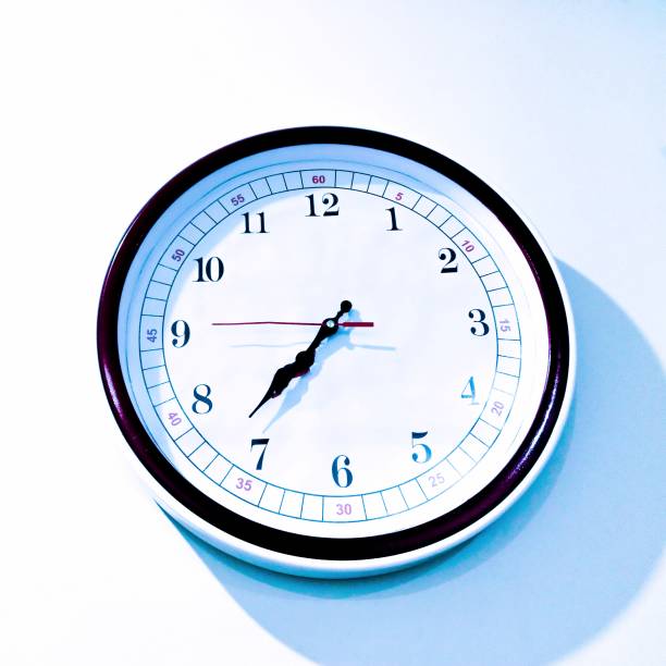 Analogue wall clock round hoursclock timeclock horloge murale, reloj pared, wanduhr, timepiece watch showing minutes seconds closeup image photo