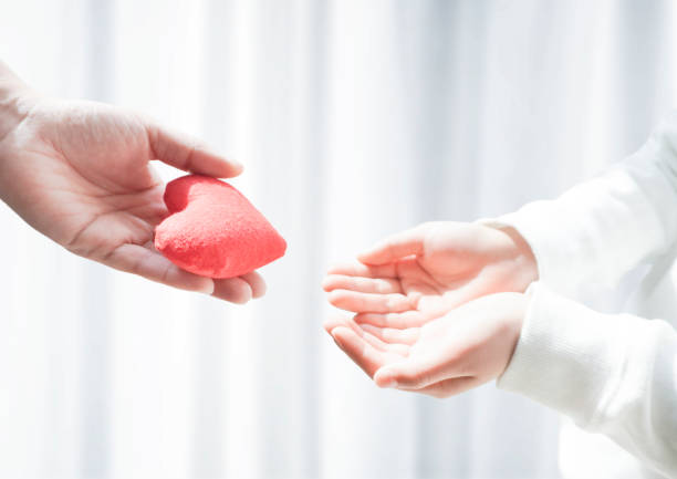 istock The exchange of hearts between two people 2162765008