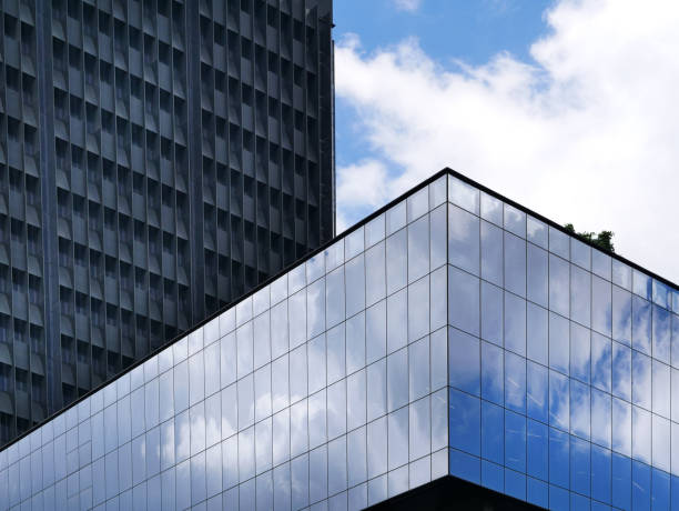 Low Angle View of Modern Buildings with Sky Reflection on Windows