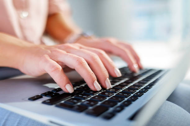 istock Anonymous Businesswoman Working on Laptop Outside 2162771018