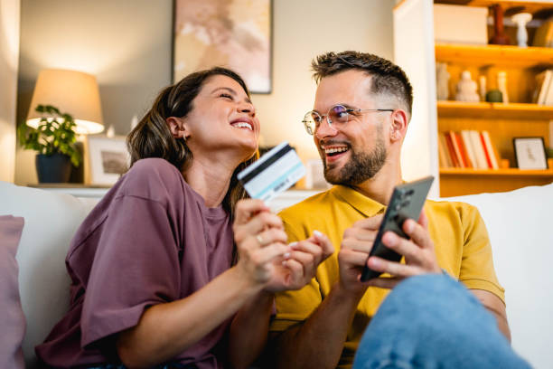 istock Young couple using smartphone for online shopping 2162774321