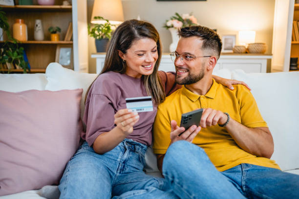 istock Young couple using smartphone for online shopping 2162774450