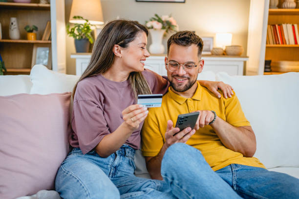 istock Young couple using smartphone for online shopping 2162774520