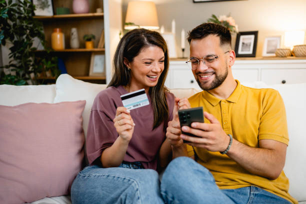 istock Young couple using smartphone for online shopping 2162774544