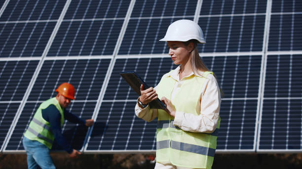 istock Architect and engineer when installing solar panels. Man and woman or team of engineers with technology at a meeting or construction planning 2162775973