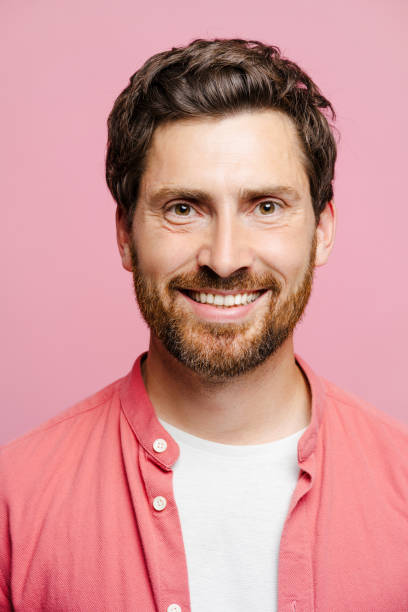 istock Happy Caucasian bearded man looking at camera, isolated on pink background in studio 2162776559
