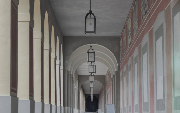 istock Long corridor with Antique lantern hanging from ceiling and Beautiful columns inside Hofgartenarkaden. 2162780418
