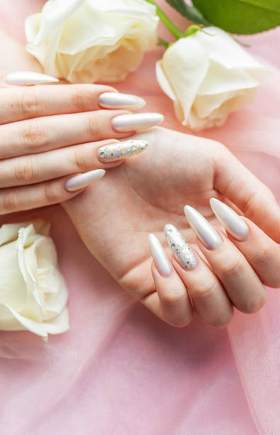 istock Female Hands with beautiful pearl manicure 2162780649
