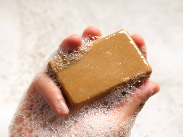 istock Man holds foaming soap in his hand. 2162780897