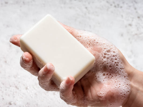 istock Woman holds foaming soap in his hand. 2162780949