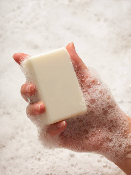 istock Woman holds foaming soap in his hand. 2162780976