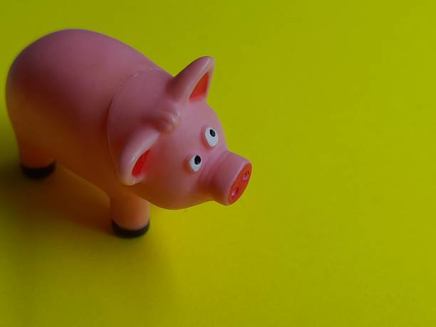 istock Pig figure with yellow background 2162781963