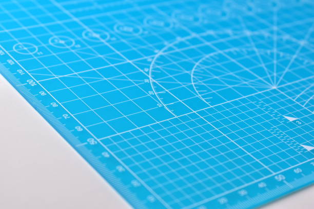 istock blue cutting mat board on white background with line and scale measure guide pattern for object art design, tool equipment of diy craft work 2162782756