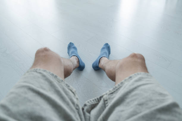 men's feet in blue socks and