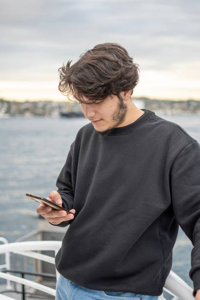 istock Handsome boy using mobile phone outdoorse 2162784637
