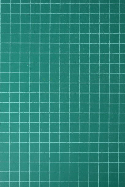 istock green cutting mat board background with line and scale measure guide pattern for object art design, tool equipment of diy craft work 2162784700