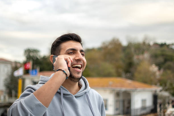 istock Handsome boy using mobile phone outdoorse 2162786311