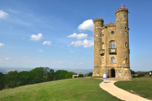 Mature man looks a ancient building on a hill