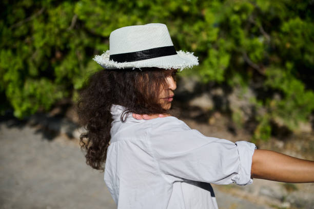 istock Woman in a sun hat taking a selfie outdoors on a sunny day 2162789346