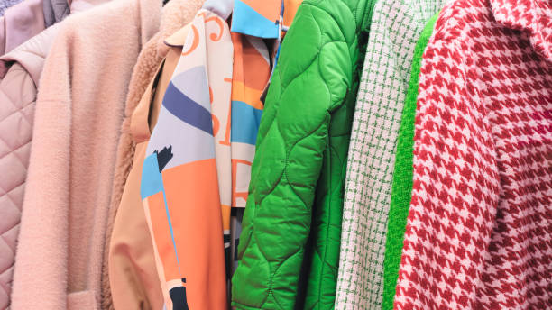 istock Multicolor family clothes on hangers in store 2162789557