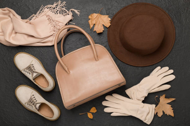 istock Stylish autumn accessories on cocrete background, top view 2162793450
