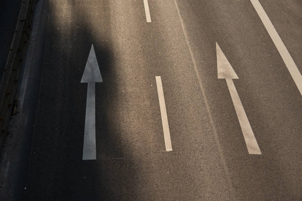 istock Directional arrows on a road 2162800098