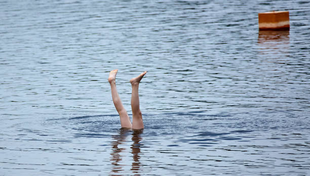 istock Feet First Dive in a Rippling Lake 2162806500