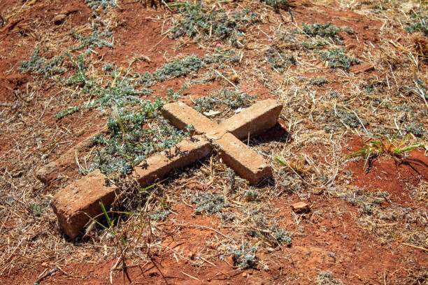 Cross religious symbol on a grave at Cimitero Monumentale (Monumental Cemetery) of Catania city in Sicily island, Italy.