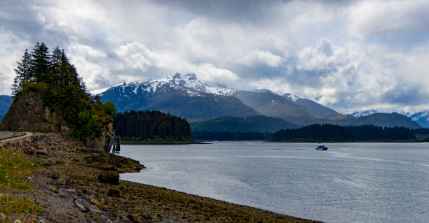 istock Small Rock Island with majestic mountain range in Alaska 2162811515