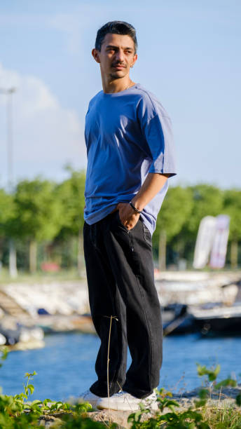 istock A handsome, young, dark-haired man spending time by the seaside 2162815287