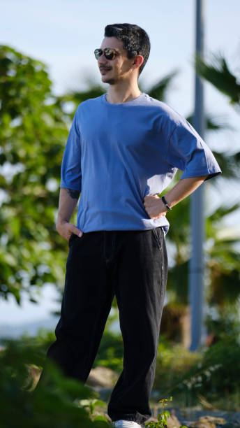 istock A handsome, young, dark-haired man spending time by the seaside 2162815372