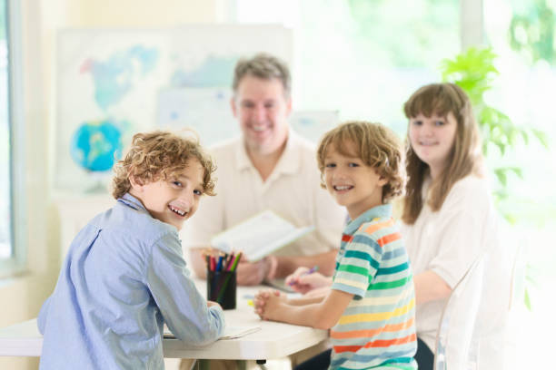 istock Back to school. Kids and teacher in classroom 2162818598