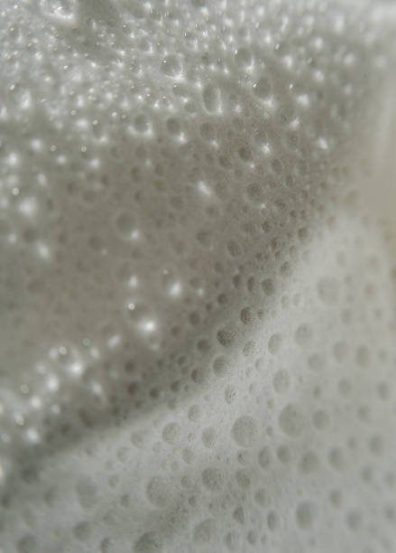 Soft focus, abstract floral background, white flower petals with water drops.
