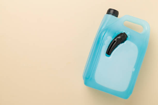 istock Can with antifreeze on color background, top view 2162822332