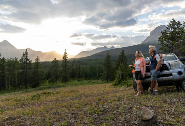 istock Senior hiking couple pause by vehicle 2162823689