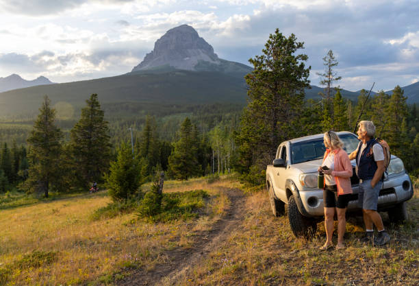 istock Senior hiking couple pause by vehicle 2162823734