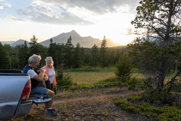 istock Senior hiking couple pause by vehicle 2162823773