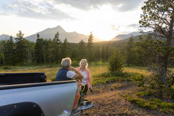 istock Senior hiking couple pause by vehicle 2162823774