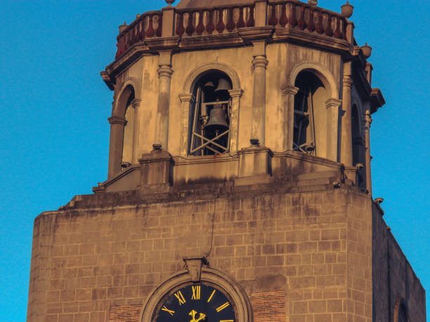 Sunset hitting the tower of a cathedral.