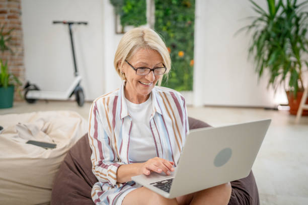 istock One woman mature caucasian female use laptop computer for work 2162831138