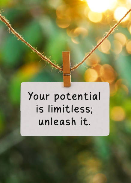 istock Note paper with the words Your potential is limitless, unleash it hanging on the ceiling with a bokeh background 2162833050