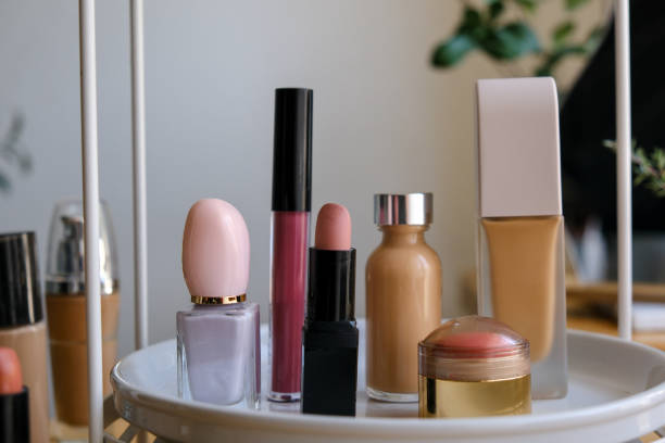 Organizer tray with makeup brushes and decorative cosmetics on the beauty table.