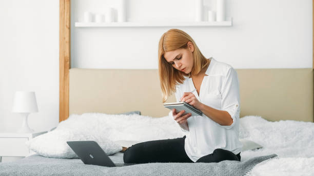 istock Working from home project idea woman laptop notes 2162834583