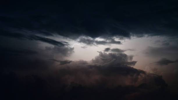 istock Dark clouds lightened by lightening at summer night. 2162835547