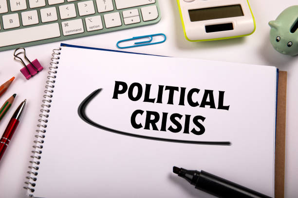 istock Political Crisis. Computer keyboard and office items on table 2162837483